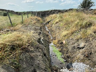 Drainage ditch, high on the hills near, Skipton, Yorkshire, UK