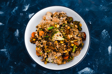 plant-based food, vegan garden vegetables and lentils casserole bake in serving dish