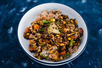 plant-based food, vegan garden vegetables and lentils casserole bake in serving dish