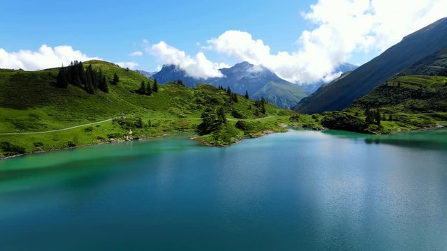 Flight over a wonderful mountain lake in the Swiss Alps - Lake Truebsee on Mount Titlis - travel photography