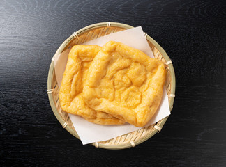 Japanese fried tofu on a black background