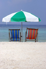 empty beach chairs with no travellers and tourists - corona virus quarantine