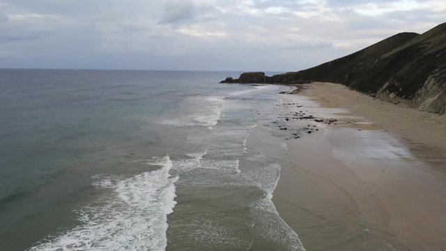 Asturias. Waves in Beach of San Antolin in Llanes,Spain. Aerial Drone Footage