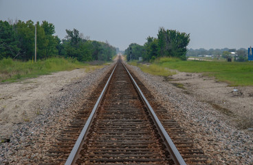 Fototapeta na wymiar Long straight railroad near Talsa, Oklahoma. August 3, 2007.