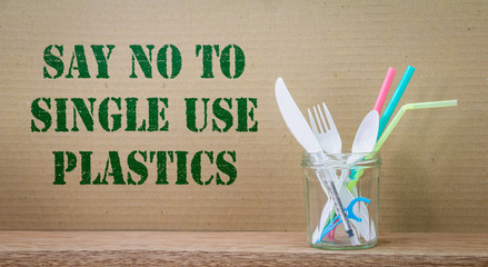 Single use plastic items Say No to Single use Plastic text on cardboard background. Zero waste and sustainable living concept