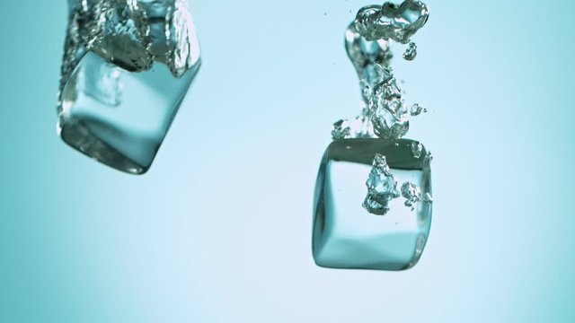Super Slow Motion of falling ice cubes, macro shot filmed on high speed cinematic camera at 1000 fps.