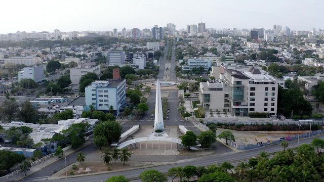 View of the heroes center on a clear afternoon, streets devastated by the pandemic in Santo Domingo, Dominican Republic, shot with drone