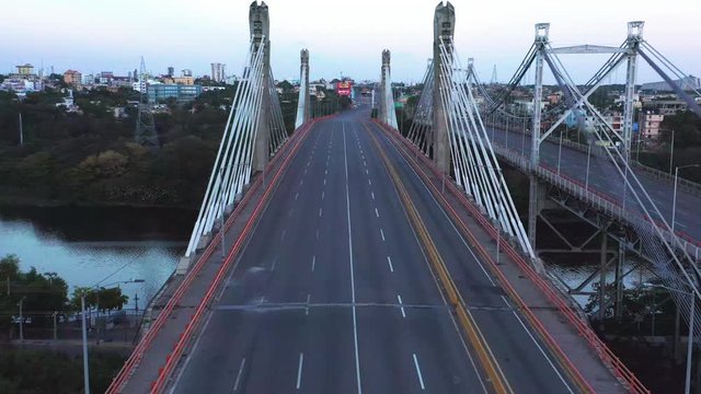 Juan Pabl&oacute; Duarte Bridge desolate by the curfew with a view to the side of the Juan Bosch Bridge at dusk