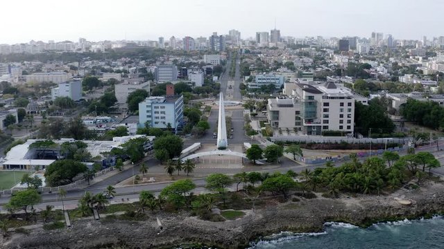 Empty, desolate and deserted Center of Heroes park and monument, Santo Domingo, Dominican Republic, covid-19 pandemic and restriction, overhead aerial approach