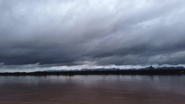 Cloudy day over border Thailand and Laos ,Mekong River are rise by rain and Dam in China release some water to the  river.