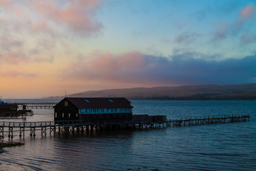 Boat House and Pier at Sunset on The  Shore of Tomales Bay, Inverness, Pt. Reyes National Sea Shore,California,USA