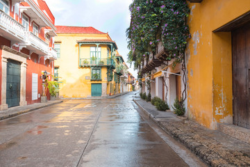 Fototapeta na wymiar Typical street scene in Cartagena, Colombia of a street with old colonial houses on each side