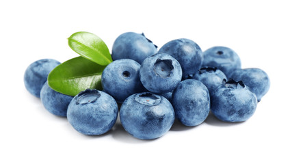 Fresh ripe blueberries with leaves on white background