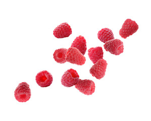 Fresh ripe raspberries flying on white background