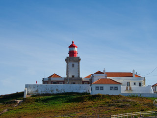 Fototapeta na wymiar The lighthouse at Cabo da Roca in Portugal which situated in the westernmost point of mainland Portugal and continental Europe.