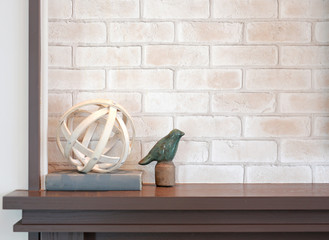 Decorative on table in modern living room against interior design brick wall background