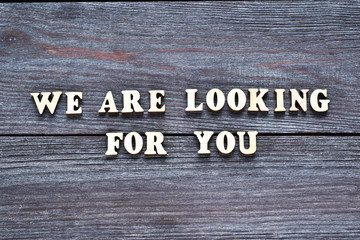 words We are looking for you on wooden background. Job board. Human Resource Management and Recruitment and Hiring concept.