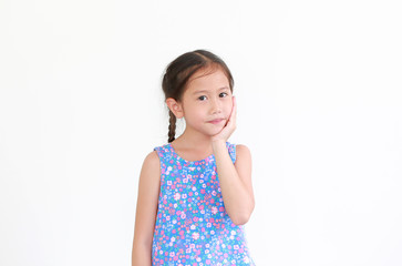 Portrait of asian little child girl touching hand on chin and cheek isolated on white background with looking at camera.