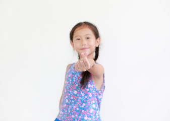 Portrait asian little child girl show finger mini heart symbol sign language isolated on white background. Focus at kid fingers.