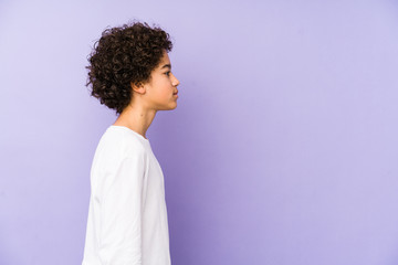 African american little boy isolated gazing left, sideways pose.