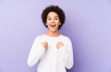 African american little boy isolated surprised pointing with finger, smiling broadly.