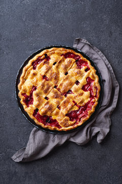 Top view image of cherry pie decorated with lattice