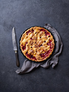 Top view image of cherry pie decorated with lattice