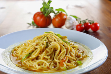 spaghetti dish close up with tomatoes