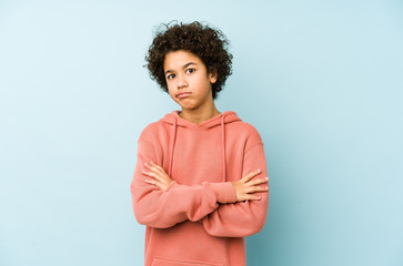African american little boy isolated unhappy looking in camera with sarcastic expression.