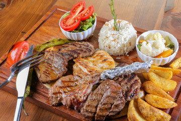 grilled steak dish course food meal in a restaurant on wood