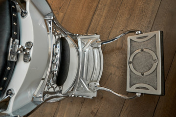 Top view of modern comfortable metal hairdressing chair for hairdresser with footrest clients in barbershop