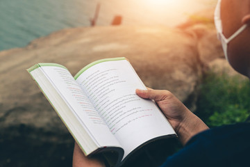 Men read book in the holiday in quiet nature, Concept reading a book.