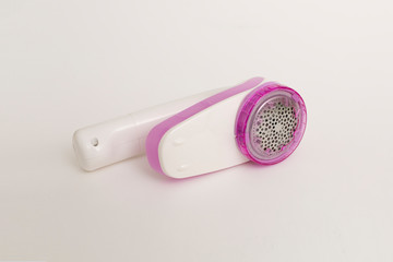 毛玉取り 衣類 洋服 家電 電気 ピンク 白 テーブル