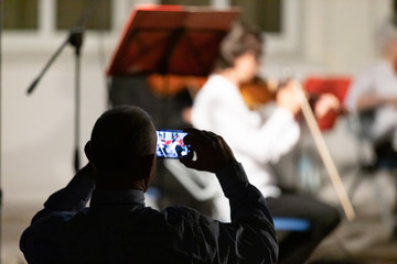 Man taking an image on his mobile phone