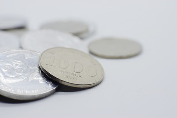 Indonesian rupiah coins close up selective focus isolated on white background