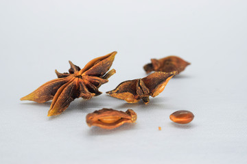 A spice commonly called star anise, staranise, star anise seed, Chinese star anise, or badian t is obtained from the star-shaped. close up selective focus isolated on white background