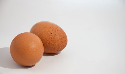 two chicken eggs on isolated white background
