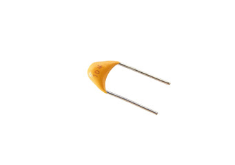 Yellow ceramic capacitor isolated on white background
