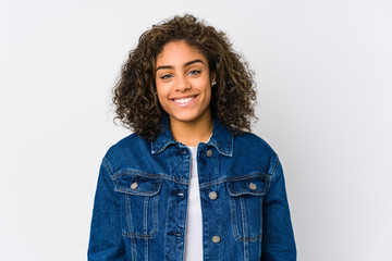 Young african american woman happy, smiling and cheerful.