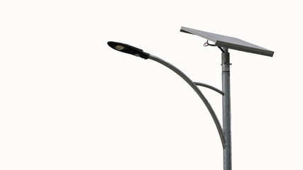 Solar panel mounted light pole and isolated from white background