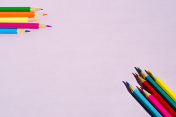 colored pencils on a blackboard