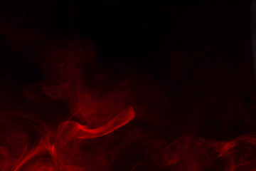 Fototapeta premium Red steam on a black background.
