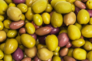 Tasty mix olives background.