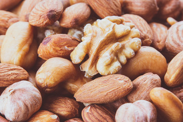 nut mix close-up, macro photo, background image, healthy food concept, top view
