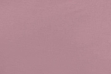 Purple homogeneous background with a textured surface, fabric.