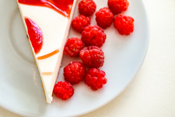 Raspberry cake and many fresh raspberries