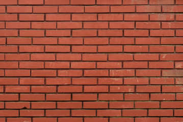 Naklejka premium Red brick wall as abstract background. Texture.