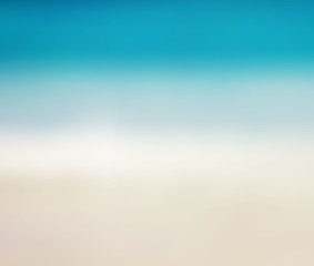 Blurred background with sea and sand. Summer vacation concept