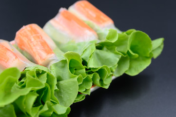 Crab stick salad rolls placed on a white plate