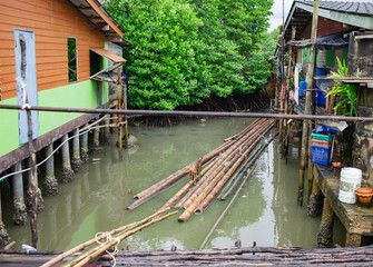 The condition of the houses of the village built in the sea.